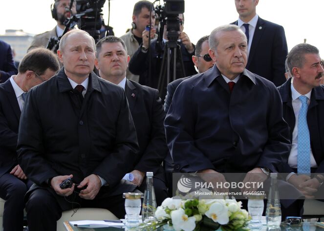 3 апреля 2018. Президент РФ Владимир Путин и президент Турецкой Республики Реджеп Тайип Эрдоган (справа на первом плане) на церемонии запуска строительства первого энергоблока атомной электростанции (АЭС) "Аккую", сооружаемой "Росатомом" в Турции, в режиме видеоконференцсвязи у президентского дворца в Анкаре. Место: Турция, Анкара. Автор: Михаил Климентьев/РИА Новости. Визит президента РФ В. Путина в Турцию