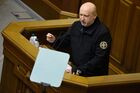 Секретарь Совет национальной безопасности и обороны Украины Александр Турчинов выступает на заседании Верховной рады Украины, где рассматривается решение о введении военного положения в стране. На фоне инцидента с нарушением российской границы украинскими кораблями Совет национальной безопасности и обороны (СНБО) Украины принял решение ввести военное положение на территории страны на 60 суток. Решение должна утвердить Верховная рада. Место: Украина, Киев. Автор: Стрингер. Заседание Верховной рады Украины
