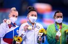 Призеры женского индивидуального многоборья соревнований по спортивной гимнастике на XXXII летних Олимпийских играх (слева направо): Ангелина Мельникова (команда ОКР) - бронзовая медаль, Суниса Ли (США) - золотая медаль, Ребека Андраде (Бразилия) - серебряная медаль, на церемонии награждения. Место: Япония, Токио. Автор: Алексей Филиппов/РИА Новости. Олимпиада-2020. Спортивная гимнастика. Женщины. Индивидуальное многоборье